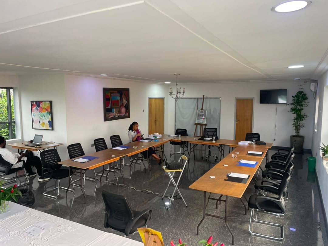 Praeclarus ADR Center hearing room with African fine art and conference tables